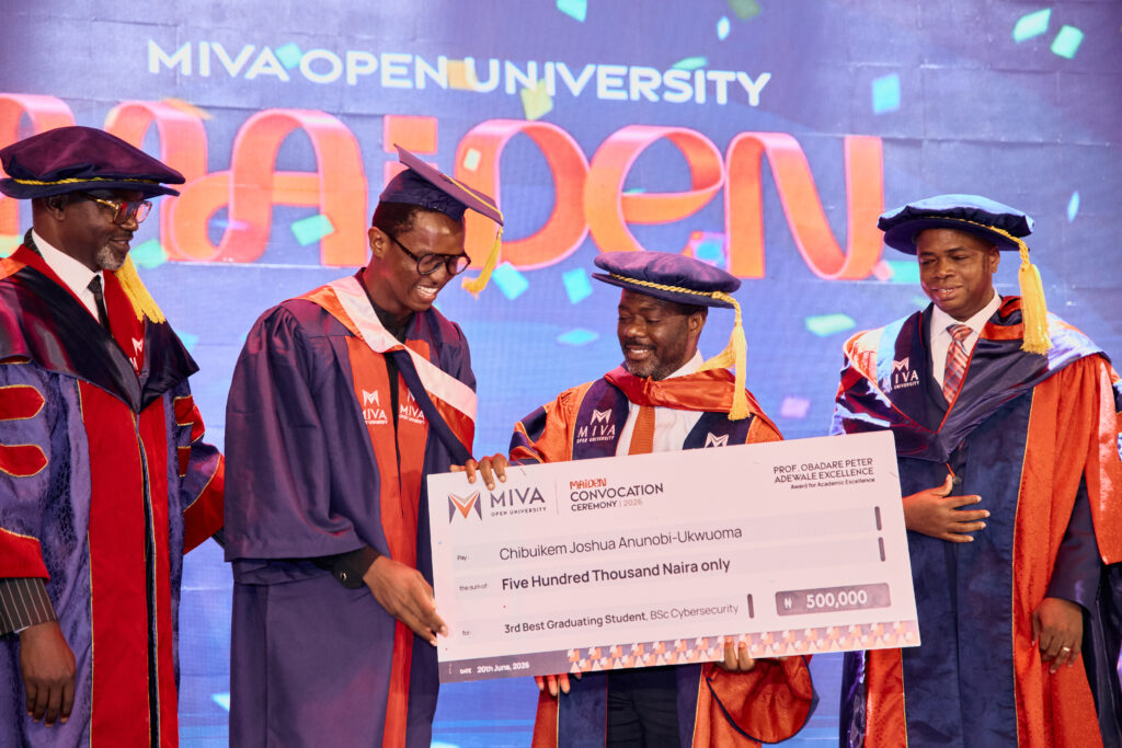 Prof. Obadare Peter Adewale presenting an award to the 3rd best graduating Cybersecurity student.